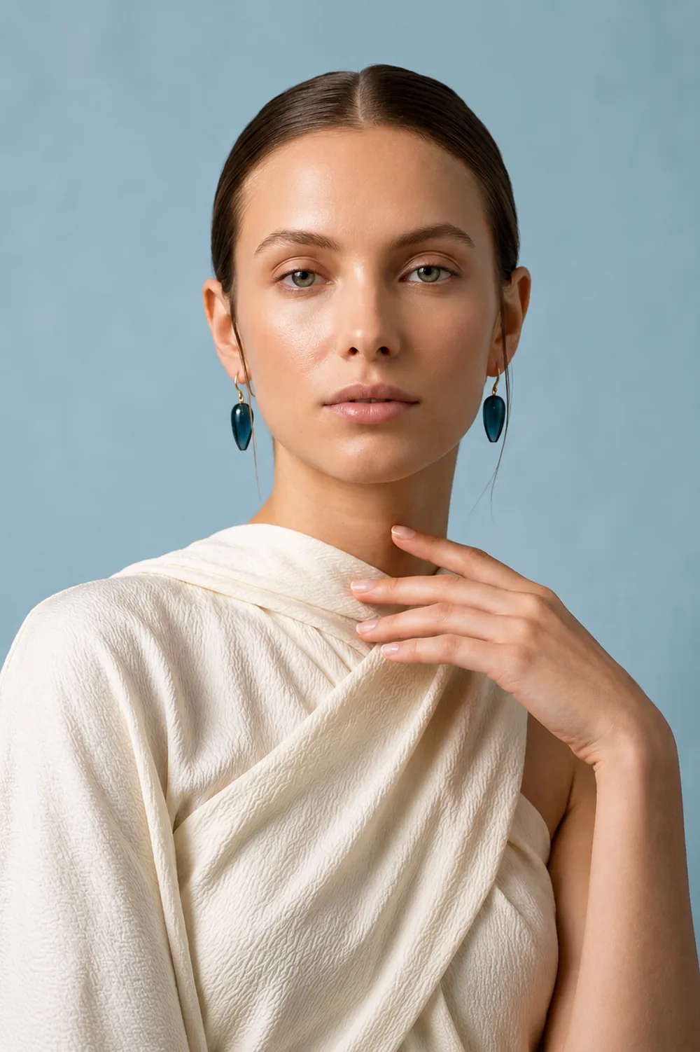 Gemstone drop earrings worn